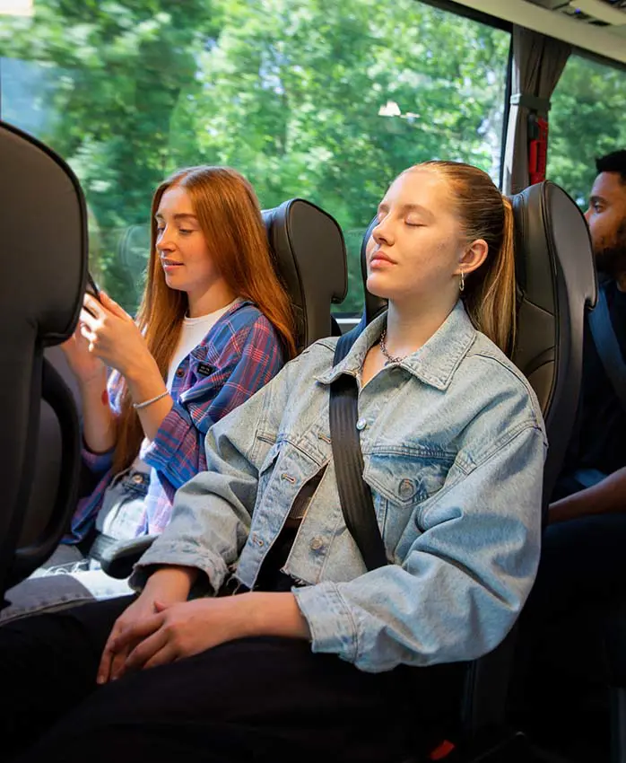 Teenagers Relaxing On A Bus