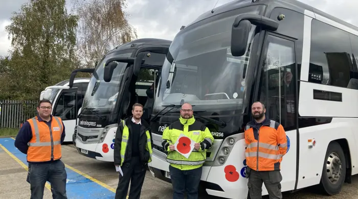 National Express Staff With Poppy Logos