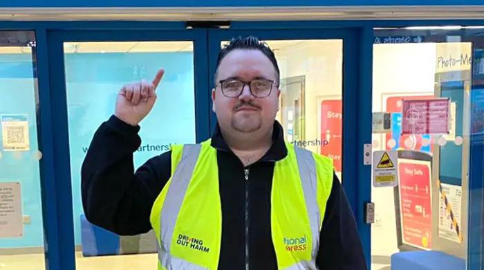 Man Outside Coventry Travelshop