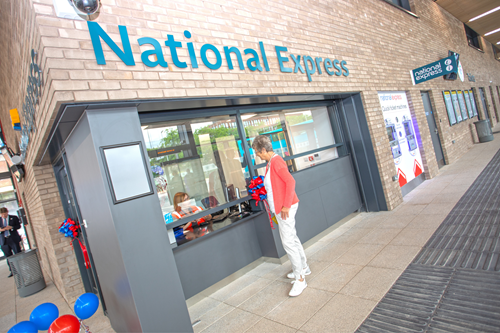 Customer being served at National Express customer service desk at Leicester St Margaret's Bus Station.